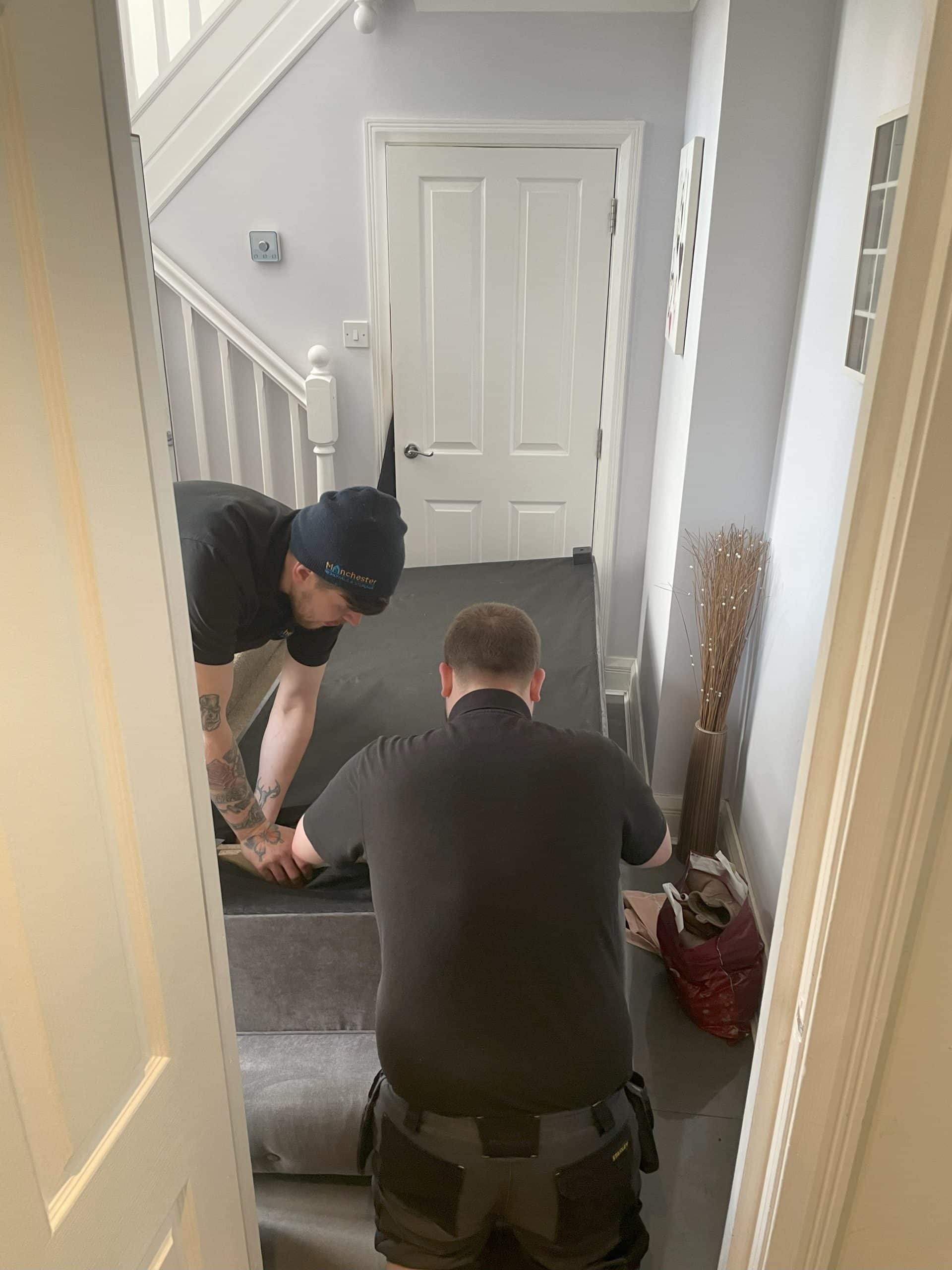 Removals Crew Dismantling a Sofa - Manchester Removals & Storage - Manchester Removals & Storage