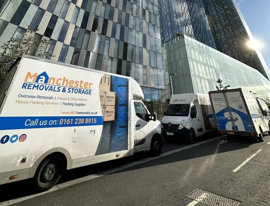 Removals vans outside Deansgate Towers