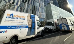 Manchester removal company loading van in city centre